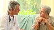 Mature woman patient talking with her doctor
