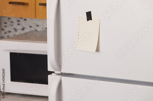 Photo: Note on refrigerator door Note on refrigerator door