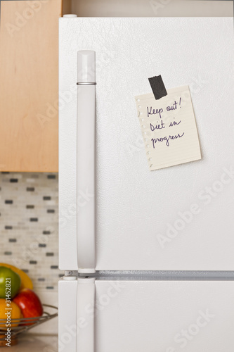 Photo: Note on refrigerator door Note on refrigerator door