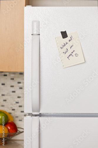 Photo: Note on refrigerator door Note on refrigerator door