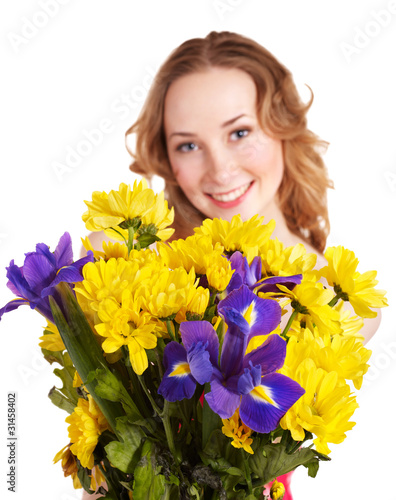 Photo: Young woman holding flowers. Young woman holding flowers.