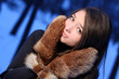 girl the teenager in fur mittens.
