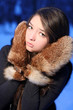girl the teenager in fur mittens.