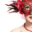 The beautiful young woman in a red mysterious venetian mask The beautiful young woman in a red mysterious venetian mask
