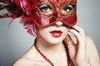 The beautiful young woman in a red mysterious venetian mask The beautiful young woman in a red mysterious venetian mask