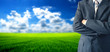 Greenfield investment concept - businessman, green field