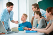 young students studying together in a classroom