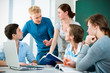 young students studying together in a classroom young students studying together in a classroom