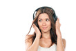 slim woman listening and enjoying music in headphones