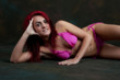 Sexy young red haired woman in bikini relaxing