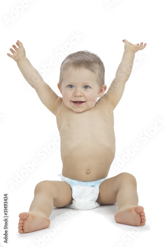 Photo: Baby boy sitting with arms raised Baby boy sitting with arms raised
