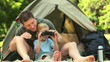 Little boy using a pair of binoculars