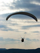 Paraglider silhouette and dramatic sky