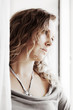 Sad woman looking out the window