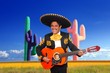 Mexican mariachi charro playing guitar in cactus Mexican mariachi charro playing guitar in cactus