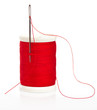 Reel with thread and needle on a white background Reel with thread and needle on a white background
