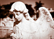 Young female angel in sepia shades