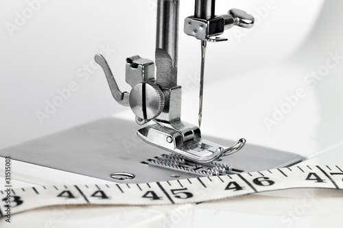 Photo: Sewing machine with a measuring tape Sewing machine with a measuring tape