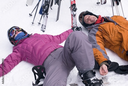 Photo: Two Skiers Resting In The Snow, Whistler, Bc, Canada Two Skiers Resting In The Snow, Whistler, Bc, Canada