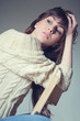 brunette sitting on a chair