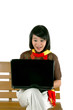 young woman surprised looking into laptop