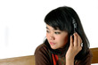 young asian woman enjoying the music