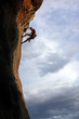 Photo: Silhouette of rock climber against cloudy sky Silhouette of rock climber against cloudy sky