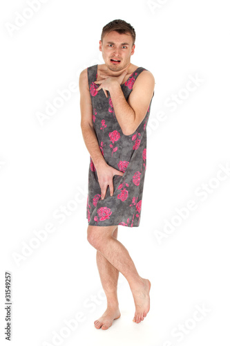 Photo: ashamed man dressed as woman in dark dress ashamed man dressed as woman in dark dress