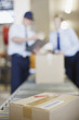 Foto: Box on conveyor belt in shipping area Box on conveyor belt in shipping area