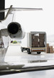 Airplane and truck being loaded with boxes