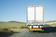 Semi-truck driving on remote rode