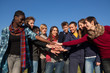 Happy College Students with Hands on Stack Happy College Students with Hands on Stack