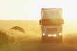 Semi-truck driving in dirt road