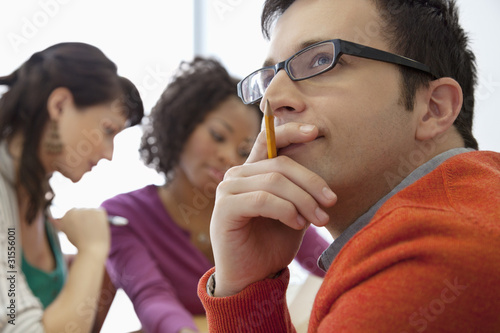 Photo: Business people working together in office Business people working together in office
