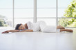 Serene woman laying on floor