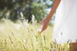 Woman walking through field