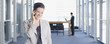 Businesswoman talking on cell phone in office
