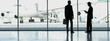 Businessmen standing in airport