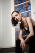 young ballerina is relaxing in class room