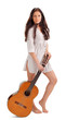 Photo: Young beautiful brunette lady in white chemise with acoustic gui Young beautiful brunette lady in white chemise with acoustic gui