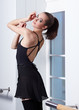 young ballerina is relaxing in class room