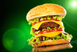 Tasty hamburger and french fries on a dark Tasty hamburger and french fries on a dark