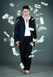 man in a suit throws money