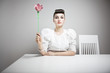 woman holding an orchid