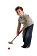 Happy boy preparing to hit a golf ball Happy boy preparing to hit a golf ball