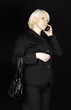 Attractive business woman talking on mobile phone