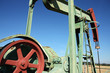 detail of small scale crude oil pump under sky