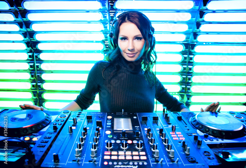 Photo: Attractive girl DJ in the nightclub Attractive girl DJ in the nightclub