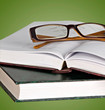 Eyeglasses on open book