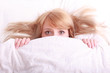 young beautiful afraid woman in bed